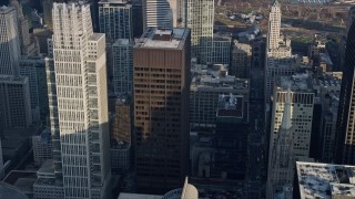 AX0169_0061 - 4K aerial stock footage of Grant Thornton Tower and Richard J. Daley Center skyscrapers, Downtown Chicago, Illinois