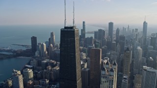 AX0169_0069 - 4K aerial stock footage of the top of the John Hancock Center skyscraper, Downtown Chicago, Illinois