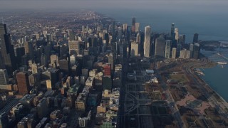 AX0169_0087 - 4K stock footage aerial video of flying across the downtown area of the city by Grant Park, Downtown Chicago, Illinois
