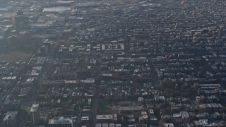 AX0169_0090 - 4K aerial stock footage of passing urban neighborhoods in North Side Chicago, Illinois
