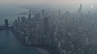 AX0169_0091 - 4K aerial stock footage approach John Hancock Center and downtown from the lake, Downtown Chicago, Illinois