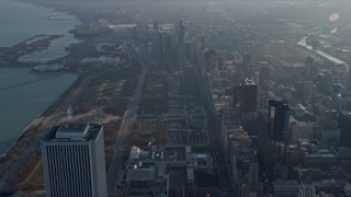 AX0169_0092 - 4K aerial stock footage fly over skyscrapers toward Grant Park, Downtown Chicago, Illinois