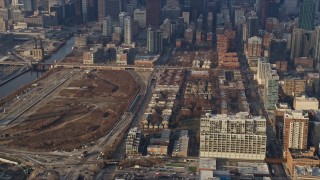 AX0169_0102 - 4K aerial stock footage reverse view of apartment buildings in South Side Chicago, Illinois