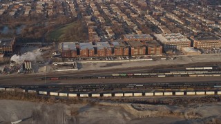 AX0169_0104 - 4K aerial stock footage of a train yard and factory buildings in Southwest Side Chicago, Illinois