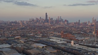 AX0170_0007 - 4K aerial stock footage wide view of the Downtown Chicago skyline seen from West Side at sunset, Illinois