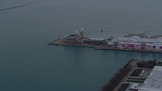 AX0170_0030 - 4K aerial stock footage of the end of Navy Pier at sunset in Chicago, Illinois