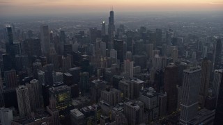 AX0170_0043 - 4K stock footage aerial video approach and fly over downtown at sunset, Downtown Chicago, Illinois