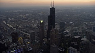 AX0170_0044 - 4K aerial stock footage fly over Trump Tower to approach Willis Tower and West Side at sunset, Downtown Chicago, Illinois