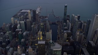 AX0170_0047 - 4K aerial stock footage of flying high over downtown at sunset, reveal Navy Pier, Downtown Chicago, Illinois