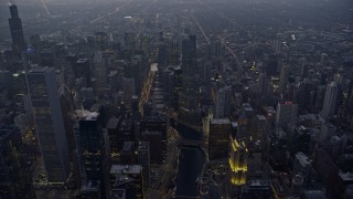 AX0170_0050 - 4K aerial stock footage of flying over Chicago River and Downtown Chicago skyscrapers at sunset, Chicago, Illinois