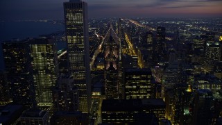 AX0170_0063 - 4K aerial stock footage fly over Two Prudential Plaza, reveal Grant Park at twilight, Downtown Chicago, Illinois