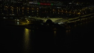 AX0170_0095 - 4K aerial stock footage of Adler Planetarium at night, Chicago, Illinois