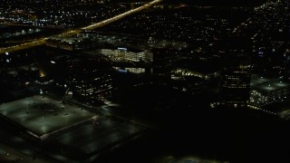 AX0170_0116 - 4K aerial stock footage of office buildings at night in Itasca, Illinois