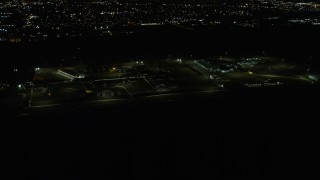 AX0170_0131 - 4K aerial stock footage of a view of Stateville Correctional Center prison at night, Crest Hill, Illinois