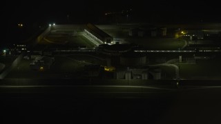 AX0170_0132 - 4K aerial stock footage of flying away from Stateville Correctional Center prison at night, Crest Hill, Illinois
