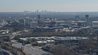 AX0171_0005 - 6.7K aerial stock footage tilt from Interstate 75 and heavy traffic, reveal Truist Park baseball stadium, Atlanta, Georgia