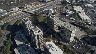 AX0171_0007 - 6.7K aerial stock footage of flying around office buildings in Atlanta, Georgia