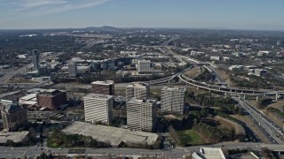 AX0171_0008 - 6.7K aerial stock footage of a wide orbit of office buildings and Truist Park baseball stadium, Atlanta, Georgia