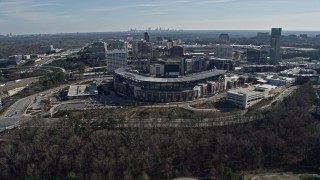 AX0171_0012 - 6.7K aerial stock footage fly over the Truist Park baseball stadium toward office buildings and Atlanta skyline, Georgia