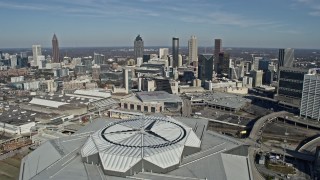 AX0171_0057 - 6.7K aerial stock footage fly over Mercedes-Benz Stadium toward Downtown Atlanta, Georgia