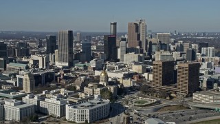 AX0171_0061 - 6.7K aerial stock footage of orbiting the Georgia State Capitol building in Atlanta, reveal Downtown skyline