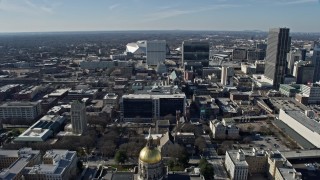 AX0171_0063 - 6.7K aerial stock footage fly over Georgia State Capitol in Atlanta toward office building and stadium
