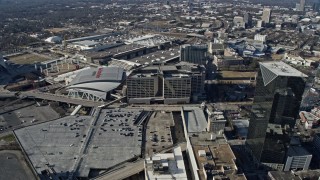 AX0171_0064 - 6.7K aerial stock footage orbit State Farm Arena, CNN Center, and Omni Hotel in Downtown Atlanta, Georgia