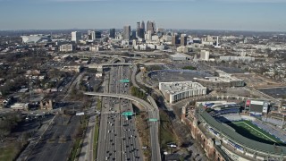 AX0171_0072 - 6.7K aerial stock footage follow freeway with heavy traffic toward the Downtown Atlanta skyline, Georgia
