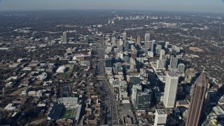 AX0171_0094 - 6.7K aerial stock footage following the freeway past Midtown Atlanta toward Buckhead, Georgia