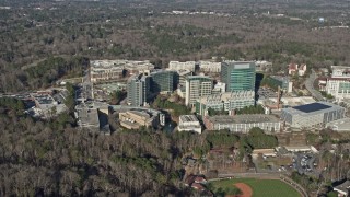 AX0171_0121 - 6.7K aerial stock footage of passing by the CDC buildings in Atlanta, Georgia