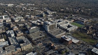 AX0171_0127 - 6.7K aerial stock footage tilt from neighborhoods to reveal and approach courthouse in Downtown Decatur, Georgia
