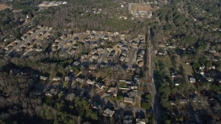AX0171_0131 - 6.7K aerial stock footage approach and tilt to suburban homes in Lilburn, Georgia