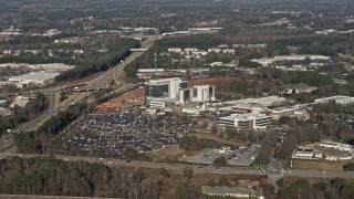 AX0171_0134 - 6.7K aerial stock footage approach a hospital in Lawrenceville, Georgia