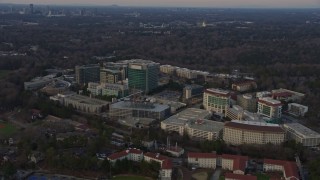 AX0171_0143 - 6.7K aerial stock footage of the Centers for Disease Control and Prevention at sunset, Atlanta, Georgia