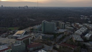 AX0171_0148 - 6.7K aerial stock footage of orbiting the Centers for Disease Control and Prevention at sunset, Atlanta, Georgia