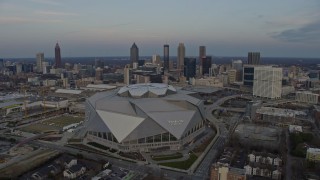 AX0171_0162 - 6.7K stock footage aerial video orbit the Downtown Atlanta skyline and stadium at sunset, Georgia