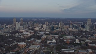 AX0171_0166 - 6.7K aerial stock footage of flying past skyscrapers in Midtown Atlanta at sunset, Georgia