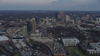 AX0171_0167 - 6.7K aerial stock footage of passing skyscrapers and apartment complexes in Midtown Atlanta at sunset, Georgia