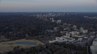 AX0171_0168 - 6.7K aerial stock footage of approaching skyscrapers and office buildings in Buckhead at sunset, Atlanta, Georgia