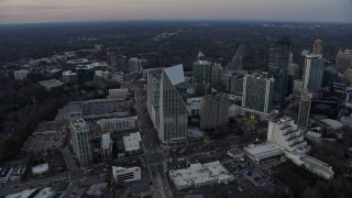 AX0171_0173 - 6.7K aerial stock footage circling the Terminus office complex at sunset, Atlanta, Georgia