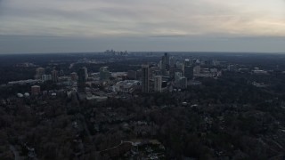 AX0171_0177 - 6.7K aerial stock footage flyby Buckhead office buildings and skyscrapers at sunset, Atlanta, Georgia