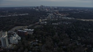 AX0171_0181 - 6.7K aerial stock footage of the Midtown Atlanta skyline seen from Buckhead at sunset, Atlanta, Georgia