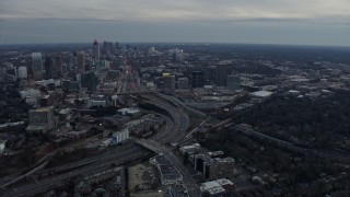 AX0171_0182 - 6.7K aerial stock footage of flying toward Midtown Atlanta and freeway at sunset, Atlanta, Georgia