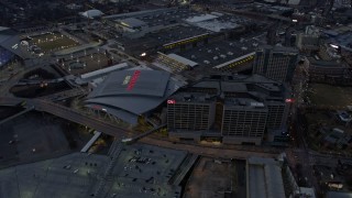 AX0171_0190 - 6.7K aerial stock footage orbit arena and CNN Center at sunset, reveal stadium in Atlanta, Georgia
