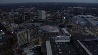AX0171_0192 - 6.7K aerial stock footage of hotel and CNN Center beside arena and stadium in Downtown Atlanta, Georgia