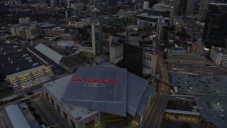 AX0171_0196 - 6.7K aerial stock footage orbit arena and CNN Center at sunset, Downtown Atlanta, Georgia