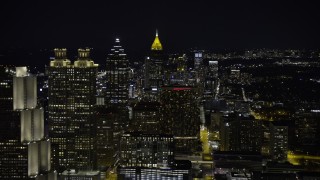 AX0171_0209 - 6.7K aerial stock footage of passing by Downtown skyscrapers at night, reveal Midtown Atlanta, Georgia