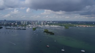 AX0172_001 - 6.7K aerial stock footage of a marina and condominiums on the shore, Miami, Florida
