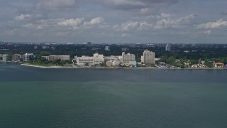 AX0172_003 - 6.7K aerial stock footage of approaching a waterfront hospital in Miami, Florida