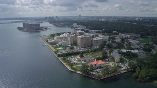 AX0172_006 - 6.7K stock footage aerial video of circling a waterfront hospital in Miami, Florida